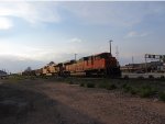 BNSF 9354 taking a train through town